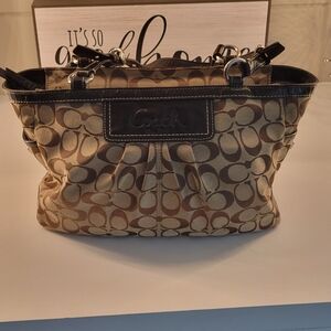 COACH Signature pleated East West Gallery tote.